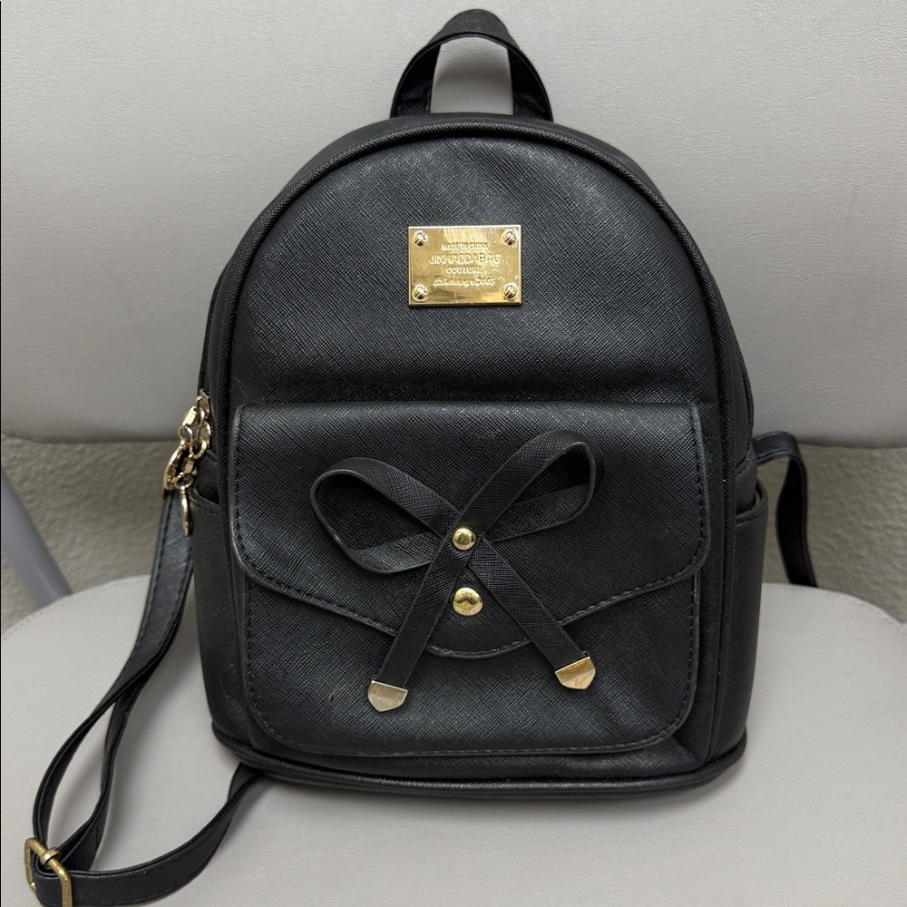 Black Backpack with Gold Accents